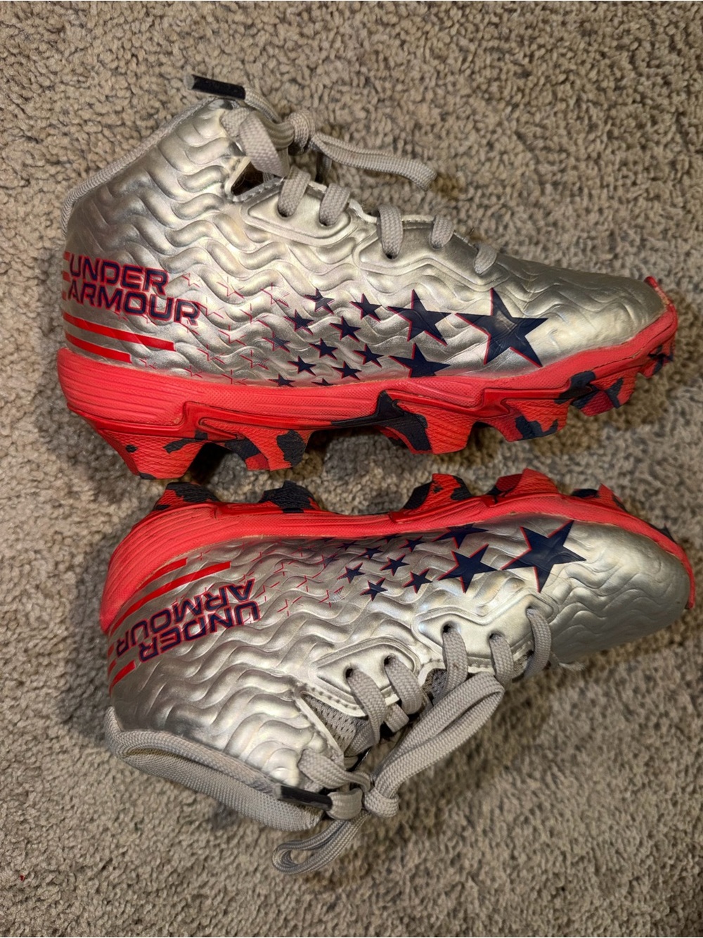 Under Armour Kids Silver Cleats with Red Soles and Navy Stars